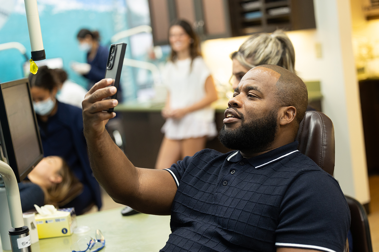 Patient looking at his new smile